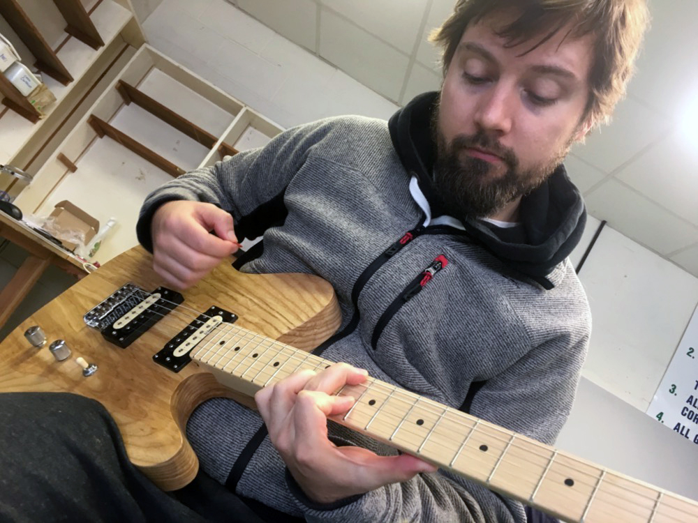 Jonathan playing a Munson custom shop guitar